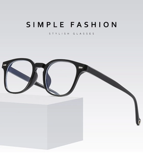 Detail view of stylish black square glasses frame on minimalist white geometric background