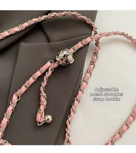Detail of pink leather woven silver chain strap with adjustable diamond metal ball buckle