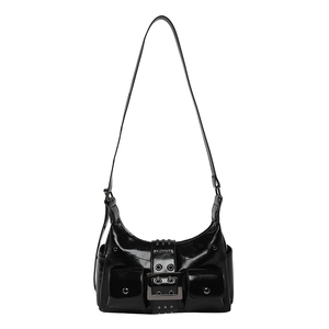 Black patent leather motorcycle bag with metal studs and multiple pockets on white background