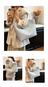 Detail shot of light blue-gray quilted tote bag with intricate diamond patterns and long straps