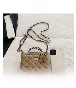 Detailed top view of a khaki quilted chain bag with suede texture and metal handle