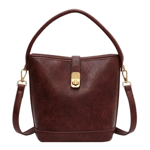 Retro dark brown PU leather bucket bag with crackle texture and gold twist lock