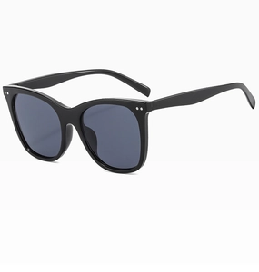 Detail of black cat-eye sunglasses featuring silver dot metal accents on the temples