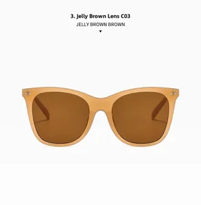 Close-up of jelly brown oversized sunglasses with metallic rivets and tea lenses