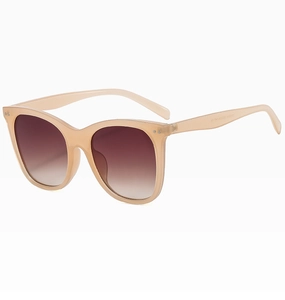 Detail view of champagne translucent frames and gradient brown lenses on sunglasses