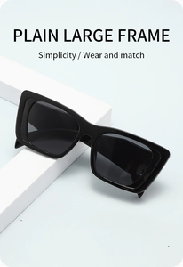 Close-up of stylish large black square polarized sunglasses with glossy finish frames
