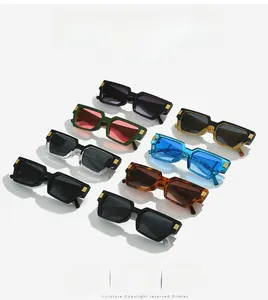 Detail view of eight colorful rectangular sunglasses with golden metal rivet accents