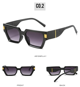 Detail view of square sunglasses with crocodile texture temples and gold metal accents
