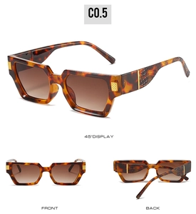 Detail of square sunglasses with faux crocodile texture temples and gold metal accents