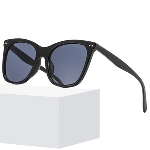 Classic black oversized sunglasses with gray-blue lenses and silver rivet accents