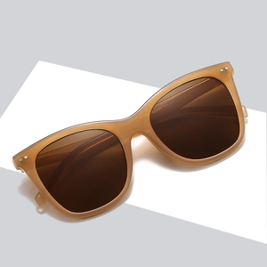 Fashionable amber tortoiseshell oversized sunglasses with dark brown polarized lenses