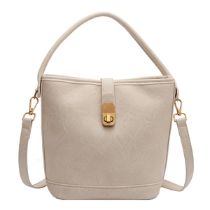 Sac seau beige minimaliste avec fermoir tournant doré et bandoulière réglable pour femme