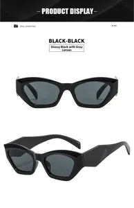 Close-up of retro black cat-eye sunglasses with irregular frames and dark gray lenses