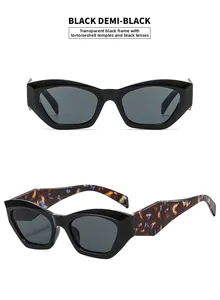 Close-up of retro black square frames with tortoise pattern temples and dark grey lenses