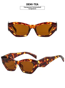 Detail view of stylish tortoiseshell cat-eye sunglasses with transparent tea lenses