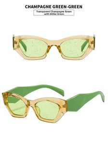 Detail of cat eye sunglasses with champagne frames and green glittery lenses