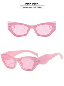 Detail view of retro cat-eye sunglasses in transparent pink with silver glitter finish