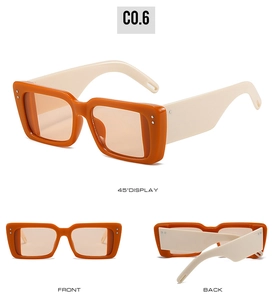 Detaillierte Ansichten der orangefarbenen quadratischen Sonnenbrille mit beigen Bügeln