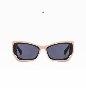 Detailed front view of beige and black cat-eye sunglasses with dark grey lenses
