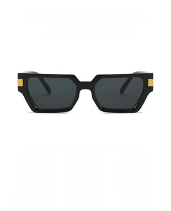 Detail of square black sunglasses with iconic gold woven metal hinge and dark lenses