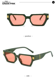 Detail view of green square frames with pink lenses and embossed crocodile texture on temples