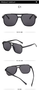 Detail view of black aviator sunglasses with dual-bridge frames and metal rivet accents
