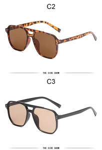 Detail view of stylish aviator sunglasses in tortoiseshell and classic black frames