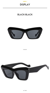 Detailed front and 45-degree side view of bold black cat-eye sunglasses with dark lenses