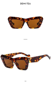 Front and side view of vintage cat-eye tortoiseshell sunglasses with brown lenses