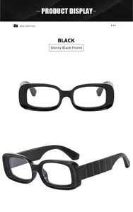 Detail view of glossy black rectangle frame glasses with textured vertical stripe temples