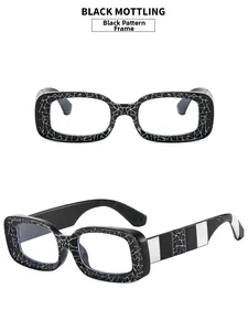 Detail of trendy rectangle glasses with unique black and white mottling pattern frames