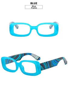 Detail of blue rectangular glasses frame with artistic black and green swirl pattern on temples