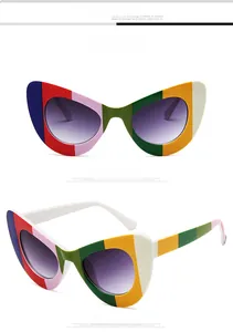 Detail view of multi-color striped butterfly cat-eye frames with purple gradient lenses