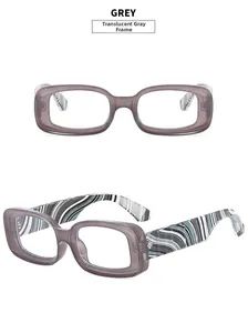 Detail of transparent grey glasses frame with blue and white striped wavy temples