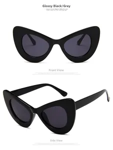 Front and side views of oversized cat-eye sunglasses with bright black frame and grey lens