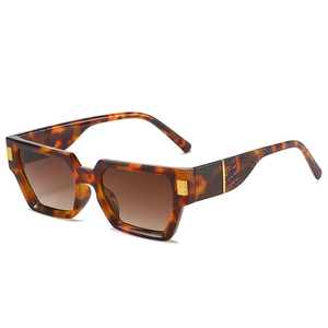 Retro tortoiseshell square sunglasses with gold accents and brown gradient lenses