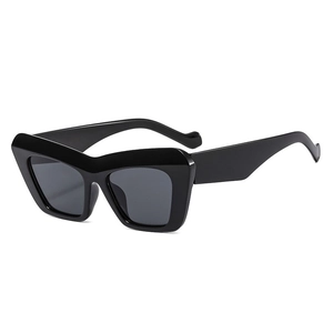 Retro black chunky cat-eye sunglasses with thick frame and dark grey UV lenses