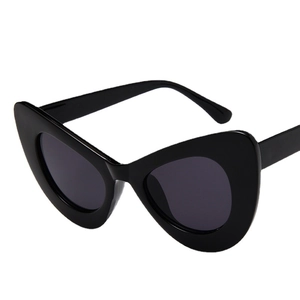 Classic oversized cat-eye butterfly sunglasses with glossy black frame and dark lenses