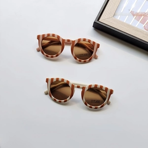Retro round checkerboard sunglasses for kids with UV400 protection and resin lenses