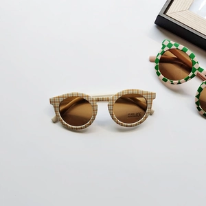 Retro checkered children's sunglasses with UV400 protection in orange and white