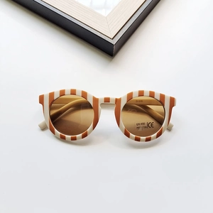 Close-up of retro kids sunglasses showing UV400 protection and CE certification marks