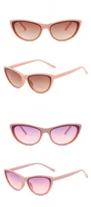 Detail view of pink cat-eye sunglasses with tea and purple gradient lenses