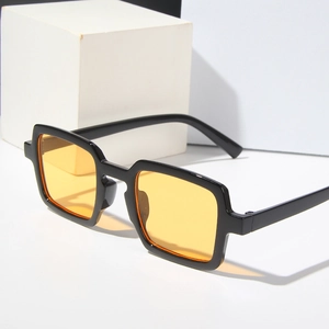 Retro square sunglasses with thick black frame and transparent orange lenses for a bold look