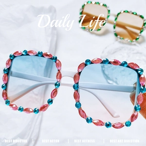Detail of square children's sunglasses with crystal rhinestones and blue gradient lenses