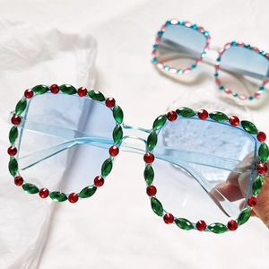 Detail shot of crystal rhinestones on light blue square frame kids sunglasses