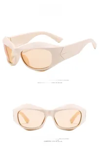 Detail of cream Y2K futuristic sunglasses with orange lenses and triangular temple design