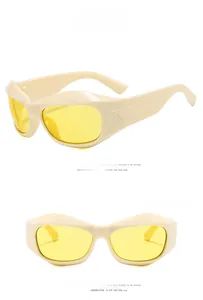 Detail view of Y2K futuristic wrap sunglasses with cream frame and yellow lenses