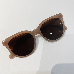 Detailed top-down view of retro square brown sunglasses with premium glossy frames