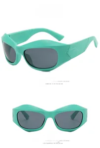Detail of green matte Y2K sunglasses featuring textured temples and gray lenses