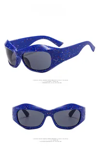 Detailed views of Y2K wrap around sunglasses with blue frame and red splatter pattern